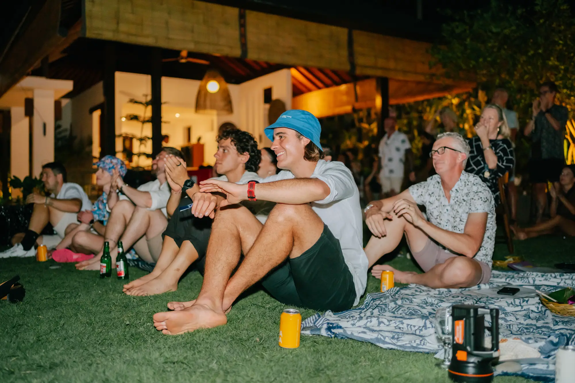 Guests relaxing on the lawn in the evening