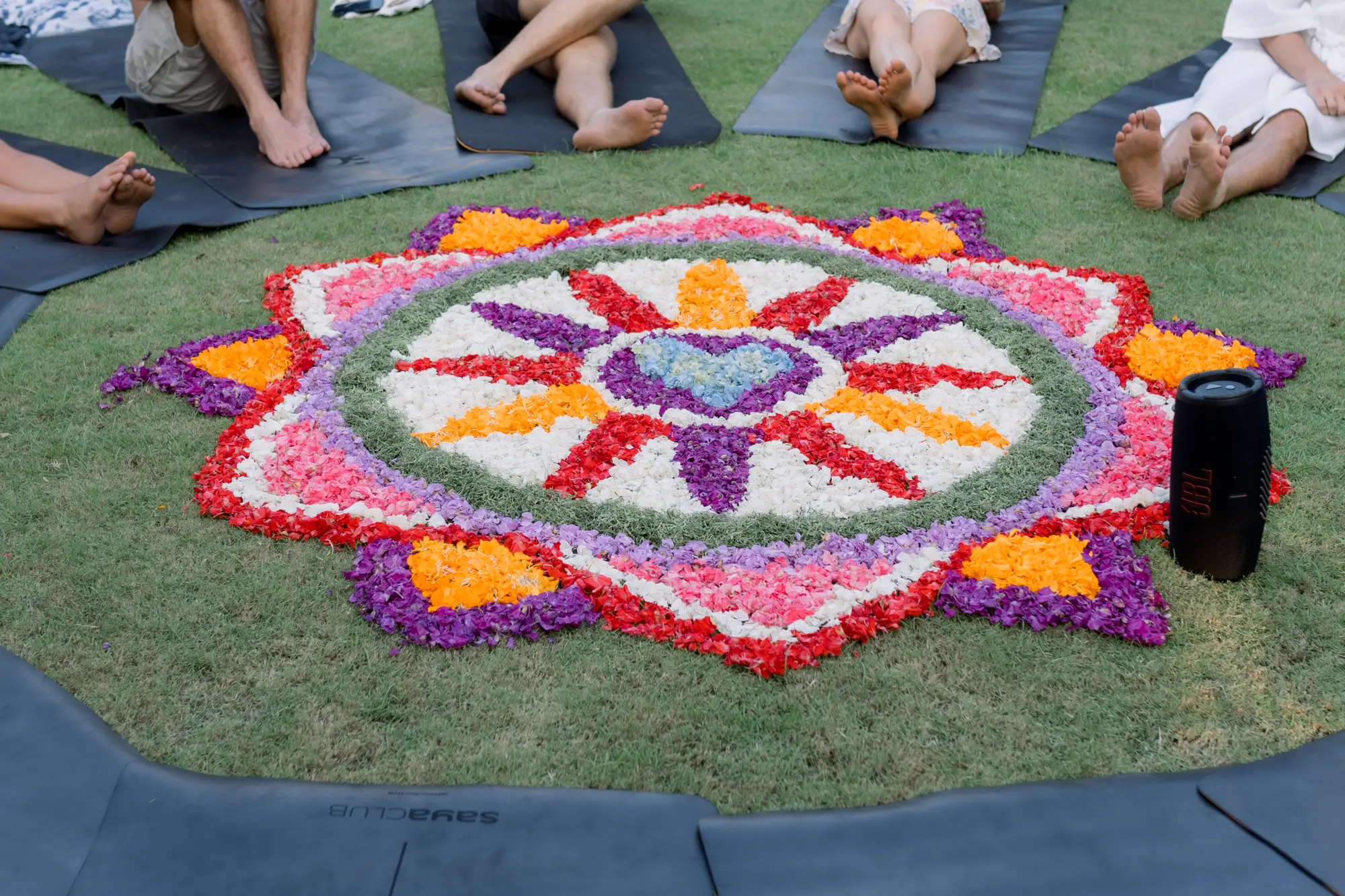 A Balinese flower mandala laid out on the lawn