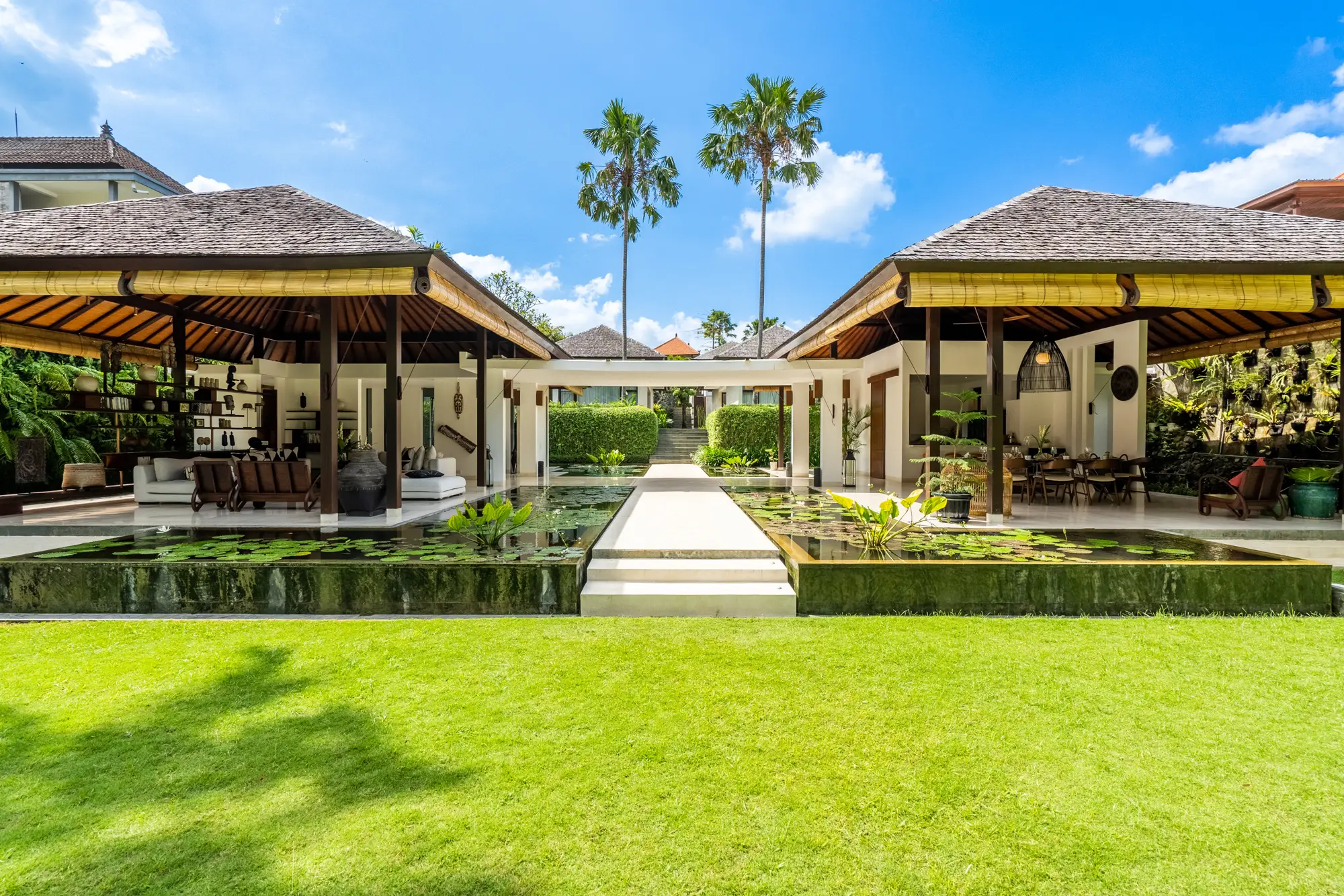 The lawn and the open pavilions under a blue sky