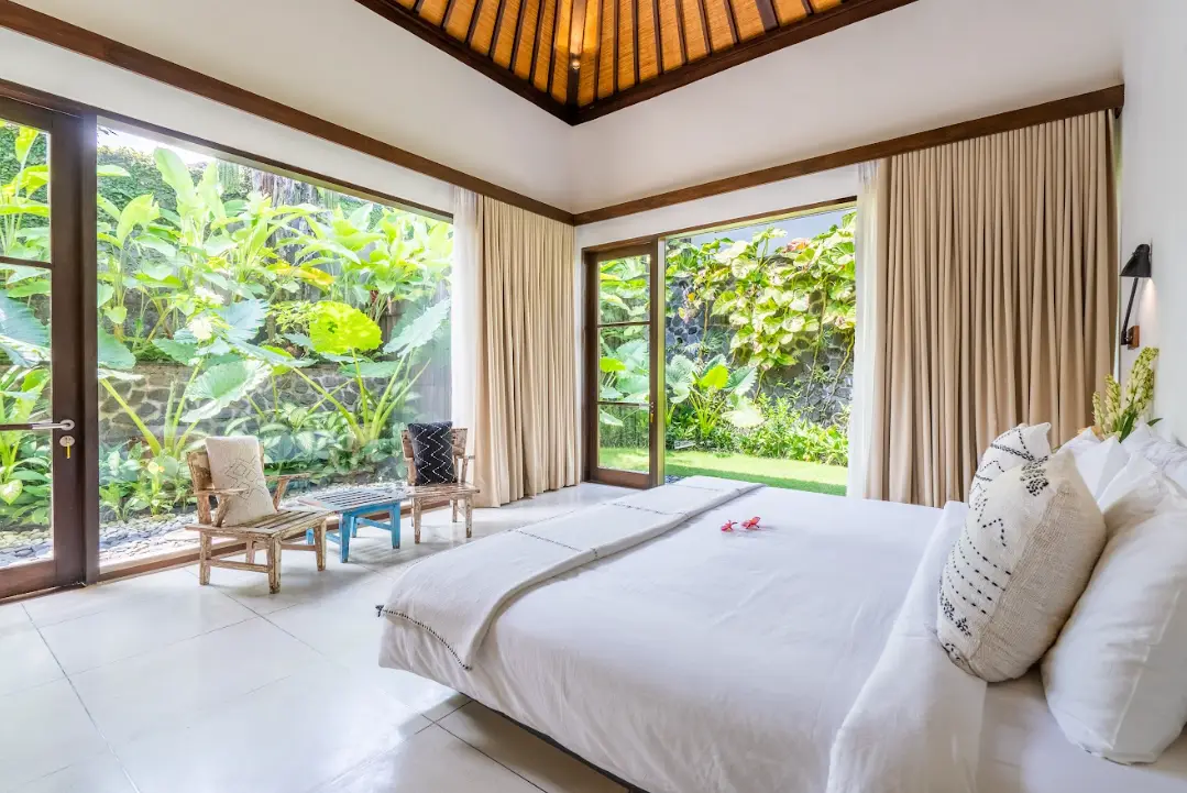 A bedroom suite with garden views