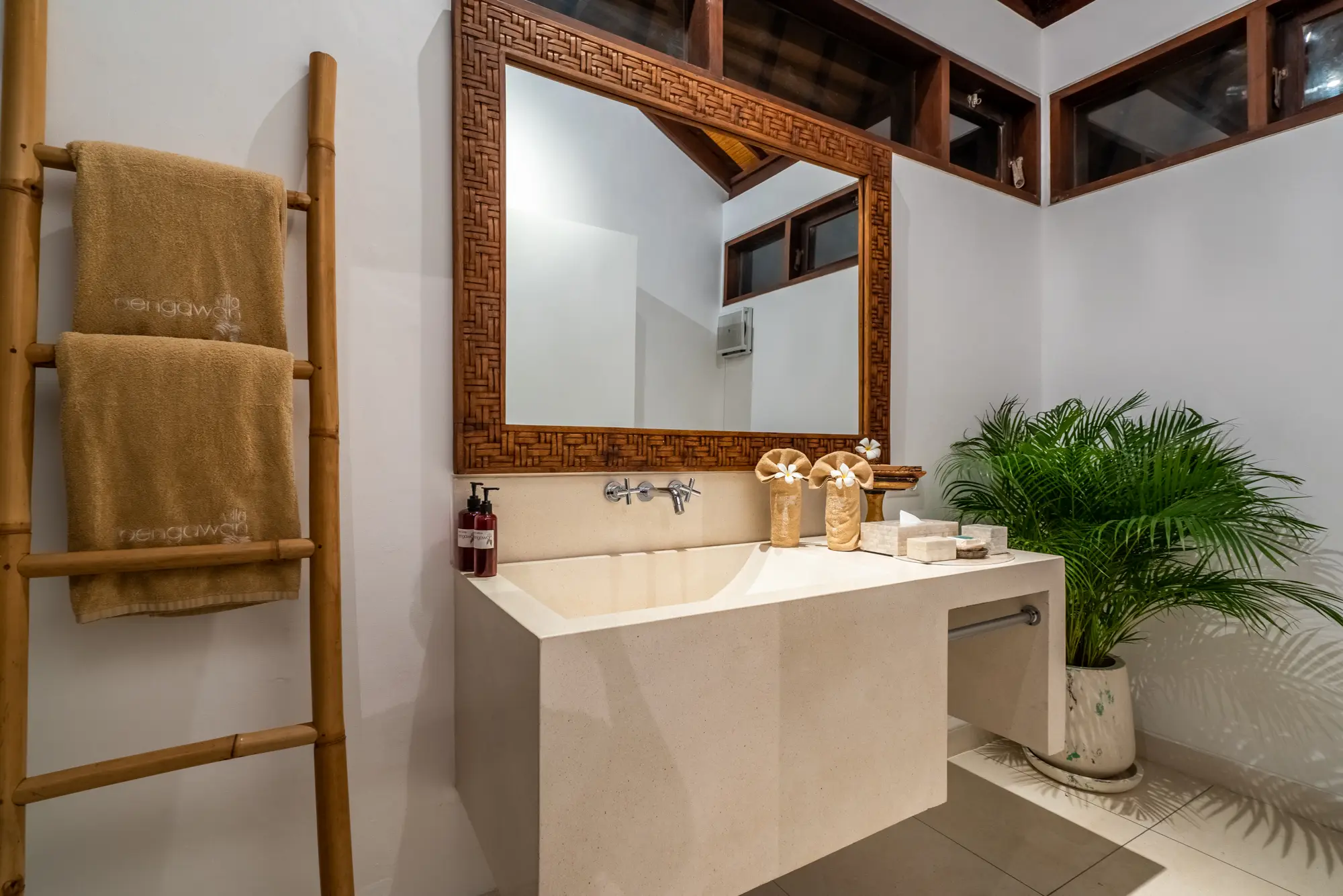 A bathroom vanity with a ladder towel rail