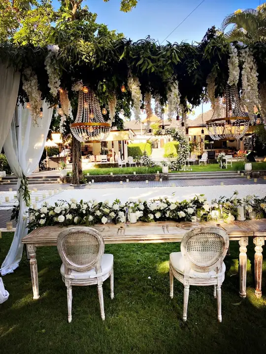 A wedding table and chairs on the lawn
