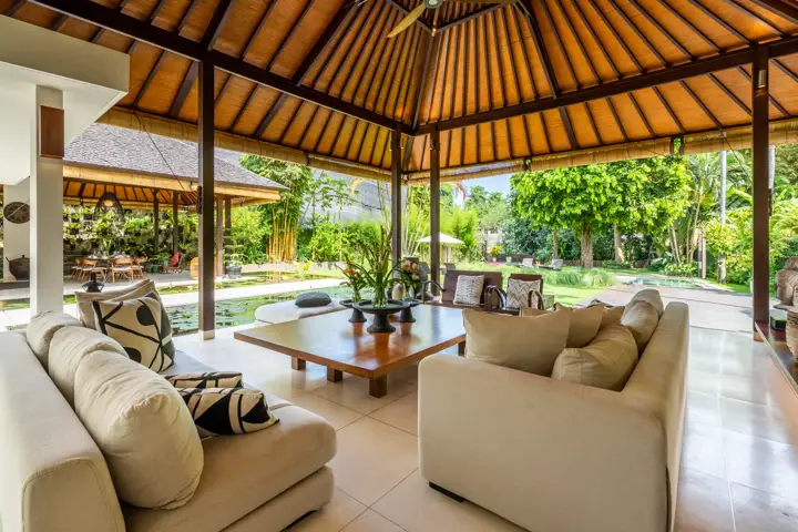 Sofas in the living pavilion beside the lotus pond