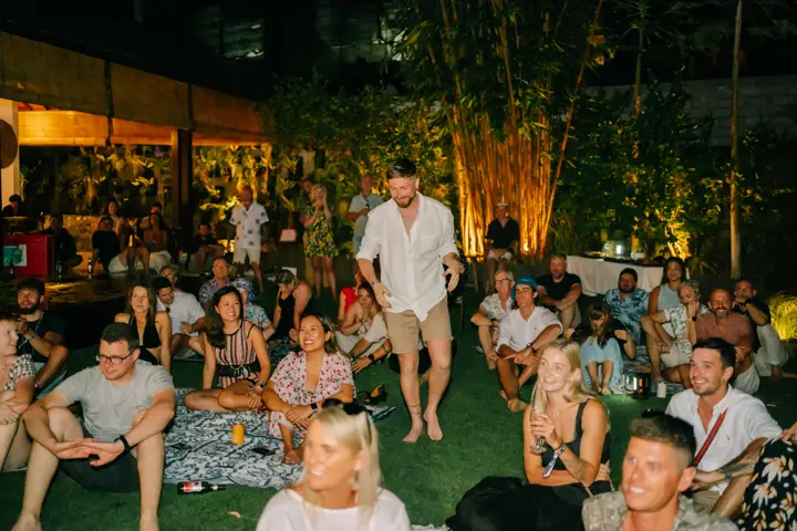 A crowd enjoying an evening party