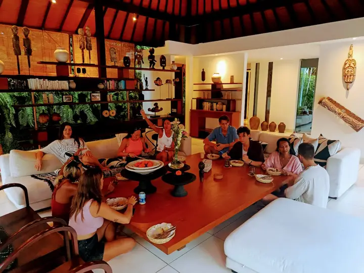 A family sharing a meal in the living room